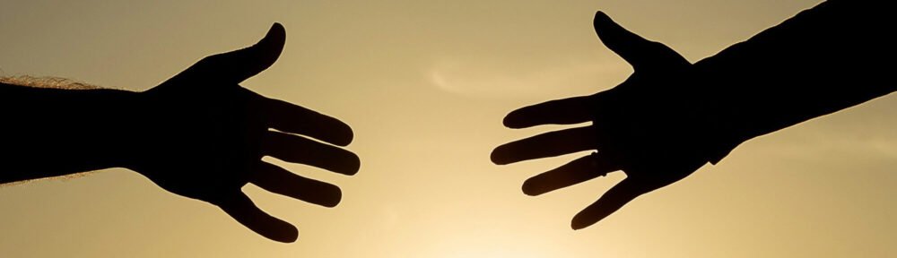 Hands Reaching Out - Ricardo Moura - Unsplash.com